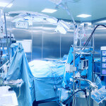 Modern operating room with the patient on the table.